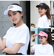 Detailed close-up of three colors of women's sports sun visors with embroidered lettering