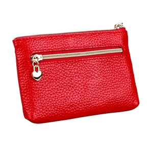 Compact red litchi grain leather purse with golden zippers and heart-shaped pendant