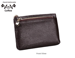 Detail of coffee brown pebble grain leather wallet with a heart-shaped golden zipper pull