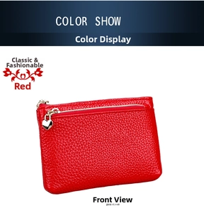 Detail view of red lychee grain leather coin purse with heart shaped gold zipper