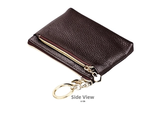 Side view of dark brown pebbled leather coin purse with heart charm and gold zipper