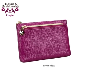Detailed view of purple pebble leather wallet with a golden heart-shaped zipper pull