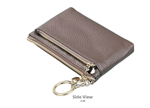 Detail view of taupe litchi grain leather coin purse with heart zipper and key ring