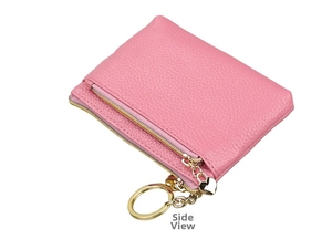 Detail view of pink litchi grain leather coin purse with heart pendant and gold zipper