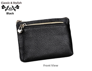 Detailed view of black litchi grain leather purse with golden zipper and heart pendant