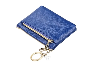 Side view of dark blue pebble leather coin purse with golden zipper and heart charm