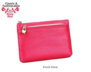 Macro view of rose red pebble leather coin purse featuring a heart-shaped metal zipper pull