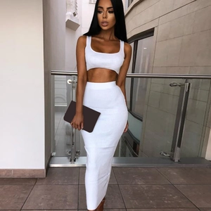 Detailed texture of white ribbed knit two-piece set featuring crop top and maxi skirt