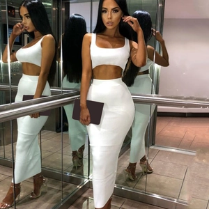 Detailed mirror view of women's white two-piece set featuring a crop top and maxi skirt