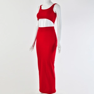 Detail view of red ribbed two-piece set featuring crop top and maxi skirt on mannequin