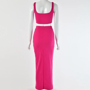Detail view of the ribbed texture on the back of a rose red crop top and long skirt set