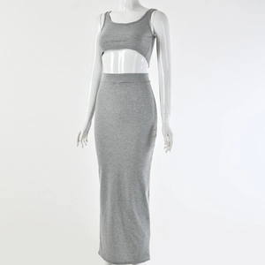 Detail of grey ribbed knit two-piece set featuring a cropped top and tight maxi skirt