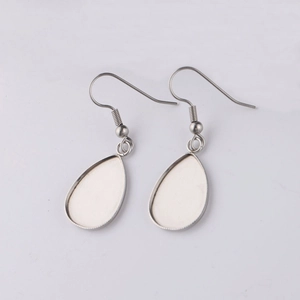 Detailed view of silver stainless steel teardrop blank bezel earring hooks for DIY jewelry