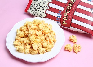 Detail of 23g resin popcorn charms in white dish with pink background