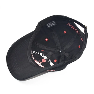 Inside view of a cotton baseball cap featuring coconut tree embroidery and wash label