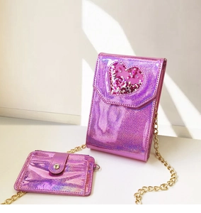 Detail of pink holographic crossbody bag with sequin heart window and metal chain