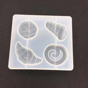 Translucent silicone mold with four slots for DIY seashell and conch resin pendants