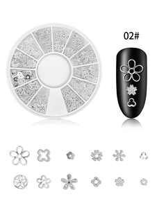 Detailed view of silver nail art charms featuring star and flower shapes in 12-grid wheel box