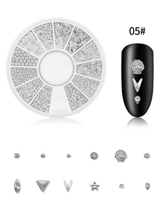 Silver star and moon nail art studs set in a 12-grid organizer box for manicure decor