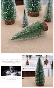 Close-up of mini snow-flocked pine trees with solid wood bases for holiday decoration