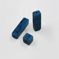 Macro detail of blue turquoise stone beads in cubic and rectangular shapes for DIY crafts