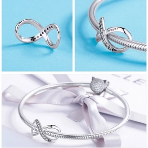 Macro detail of S925 sterling silver infinity bead with forever family engraving