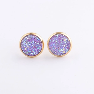 Detailed shot of 10mm gold stainless steel studs with sparkling purple mineral clusters