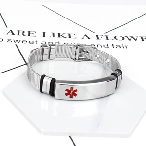 Close-up of medical alert symbol on silver stainless steel mesh bracelet and buckle