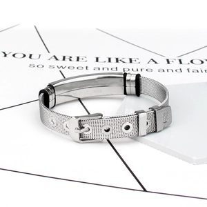 Detail of silver stainless steel mesh bracelet with belt-style buckle and adjustable holes