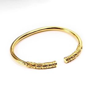 Vintage golden stainless steel open bangle bracelet with ornate auspicious cloud carving