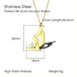 Macro detail of microscopic pendant necklace in 18K gold plated stainless steel