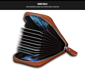 Detailed close-up of brown leather accordion card holder with multiple slots and silver zipper