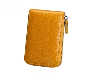Close-up of yellow genuine leather wallet showing litchi texture and metal zipper