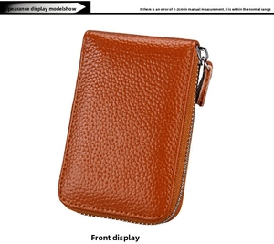 Detailed view of brown lychee grain leather wallet with U-shaped metal zipper closure