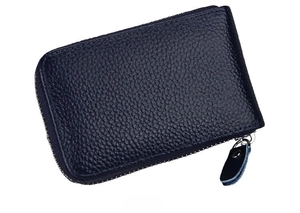Side view of dark blue leather card holder with lychee texture and metal zipper