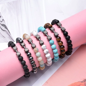 Lava stone and tiger eye beaded bracelet set with black dumbbells engraved with LIFT