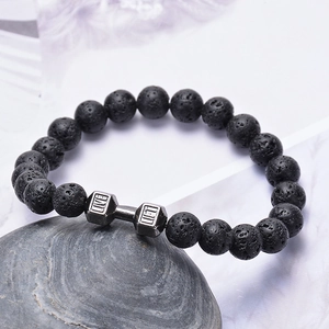 Lava stone bead bracelet with a silver dumbbell charm featuring Live and Lift engraving