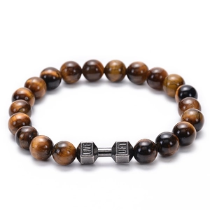 Macro shot of tiger eye stone beads featuring a matte dumbbells charm with LIFT and LIVE text