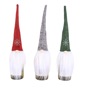 Three Nordic gnome wine bottle covers in red, grey, and green with plush white beards