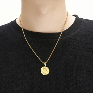 Gold plated vintage Roman coin portrait pendant on a box chain worn by a model