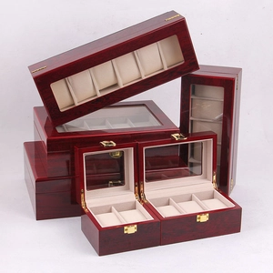 Multiple sizes of glossy wooden watch storage boxes with glass lids and beige lining