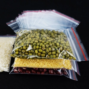 Transparent PE self-sealing bags with red trim showing food storage for beans and rice