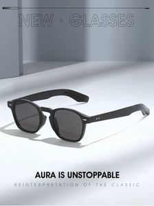 Detail of vintage black full-frame sunglasses with silver diamond accents on the hinge