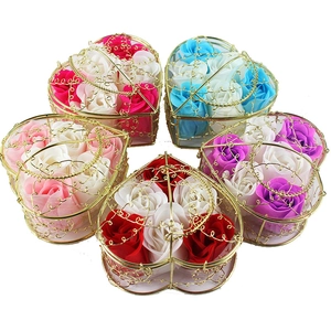 Five heart-shaped gold metal wire baskets filled with colorful soap rose flower bouquets