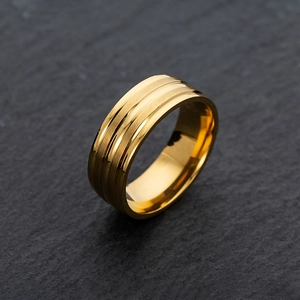 Detail of 8mm gold stainless steel ring with dual grooves and brushed matte texture