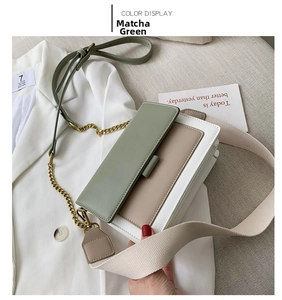 Detail of matcha green and beige colorblock crossbody bag with gold chain strap
