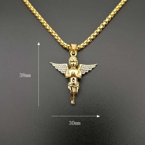 Detail view of gold angel pendant with 38mm height and 30mm width dimensions