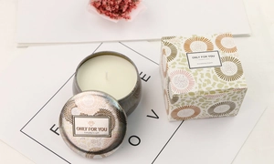 Detail of floral tin aromatherapy candle with matching square gift box and dried flowers