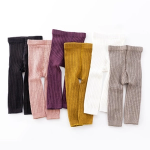 Close-up of ribbed knit texture on colorful breathable cotton baby knee pads and socks
