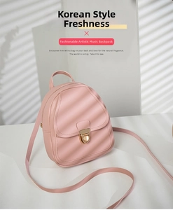 Detailed macro view of pink PU leather backpack with a gold circular metal lock closure